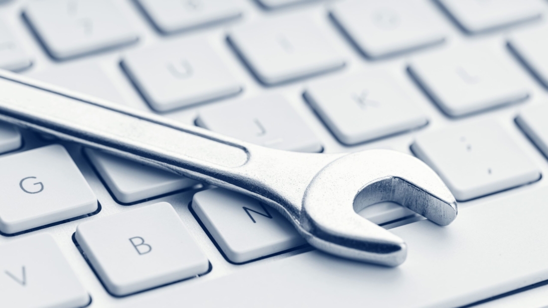 wrench-on-computer-keyboard-small